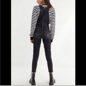 Levi’s black skinny overalls